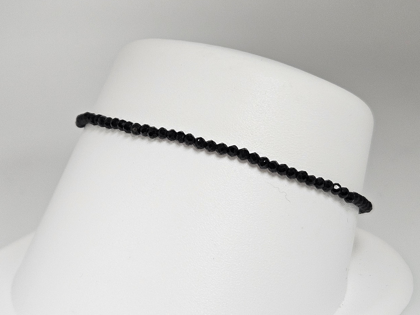 BLACK SPINEL 2MM BEAD BRAC SS