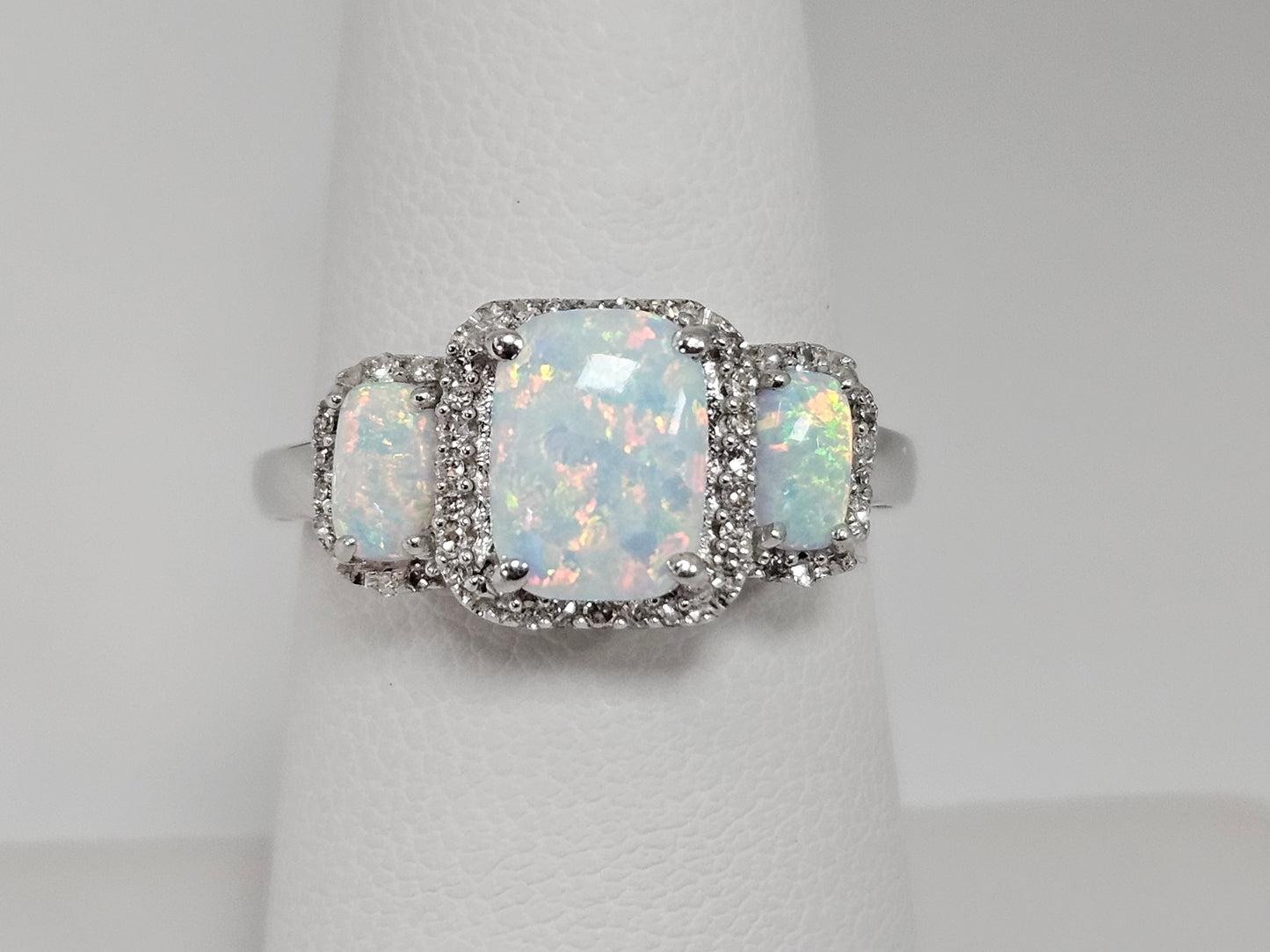 Lab Opal Ring 3 ston Halos .25ct Dia 14kwg Sz7