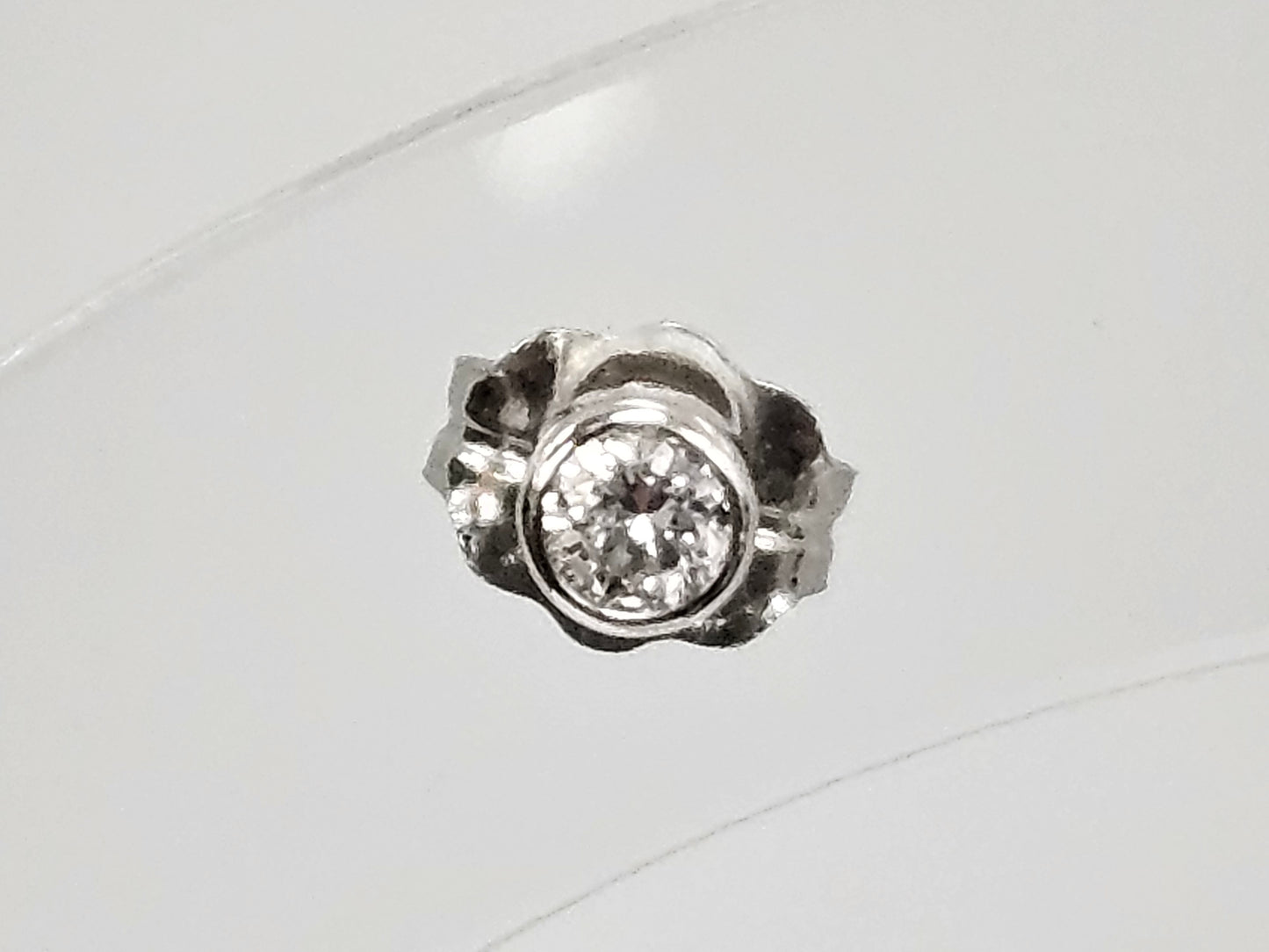 Bezel set single Dia Ear stud .06ct 14kwg