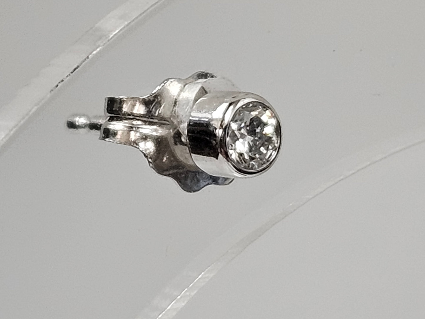 Bezel set single Dia Ear stud .06ct 14kwg