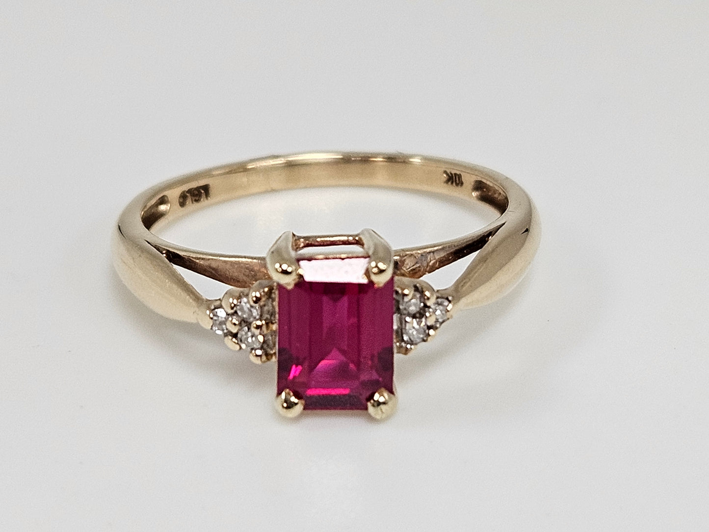 EM Ruby & Dia Rg 1ct CTN .03cttw DIA 10KYG