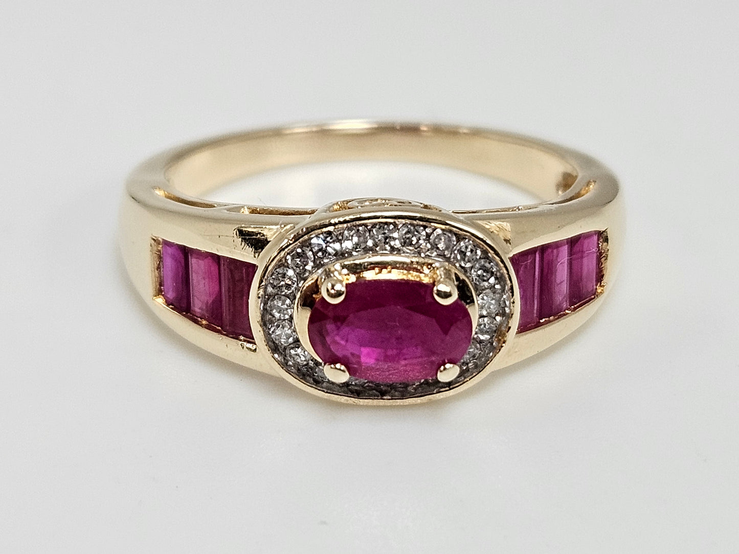 OV Ruby Halo Ring 1cttw Ruby .36ct Dia 14kYG 3.5g Sz6.75