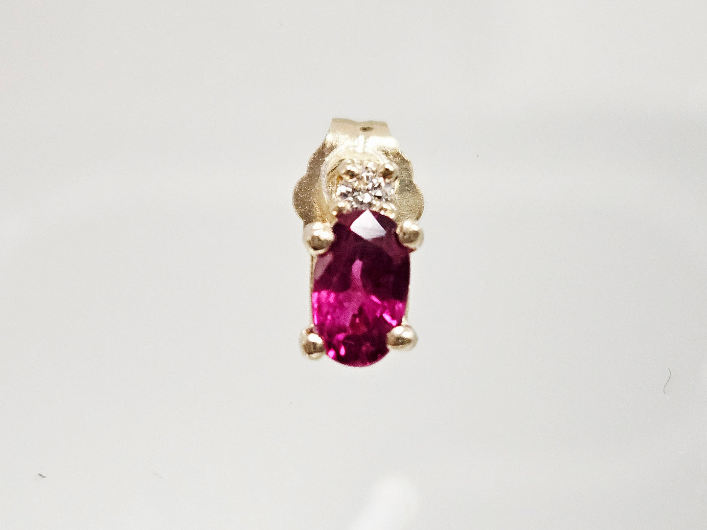 Ruby/Dia studs .66ct Ruby .06cttw Dia 14KYG