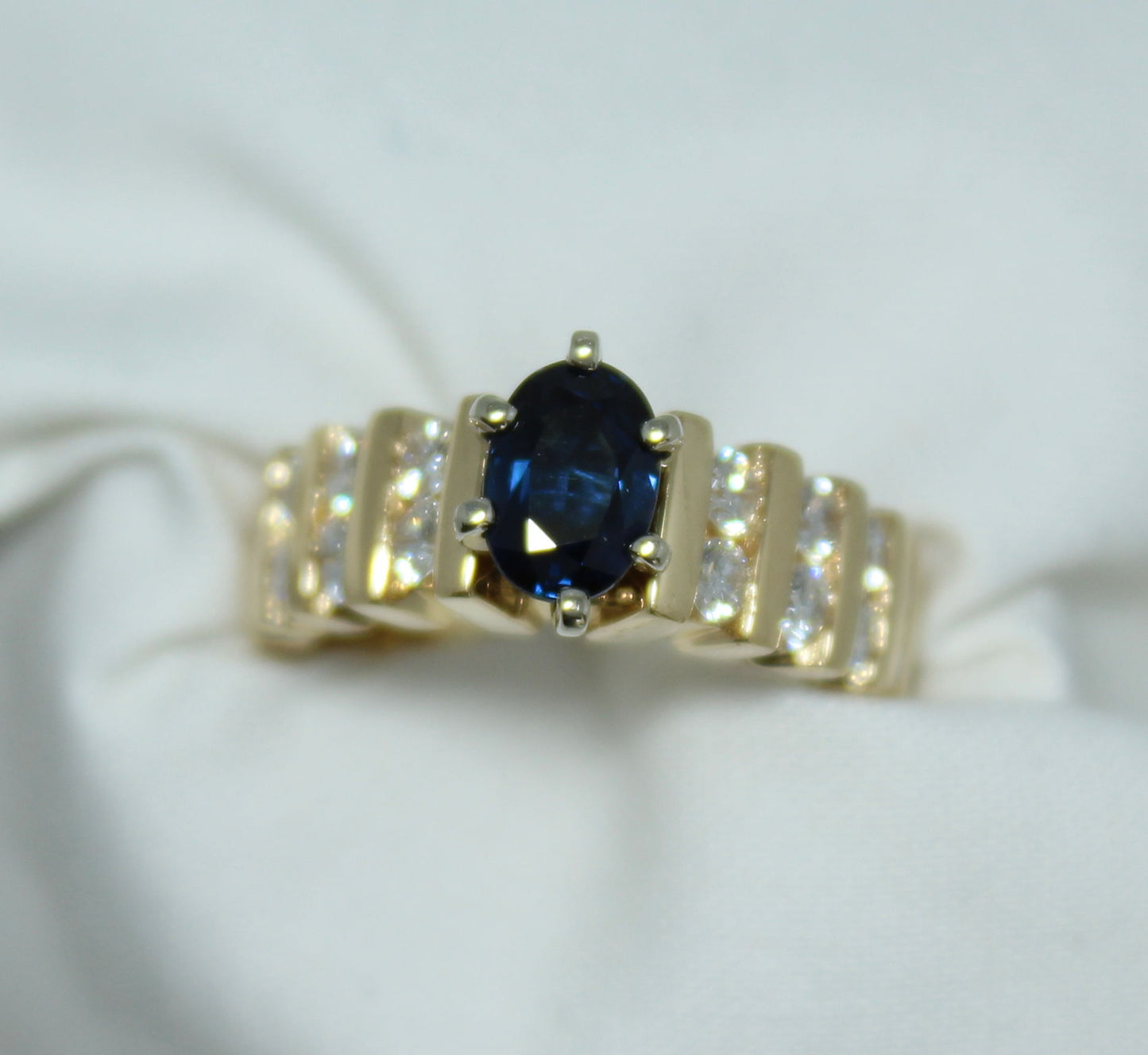 1Ct Oval Madagascar Sapphire .80Ct Diamond TW 18K YG Ladies Ring