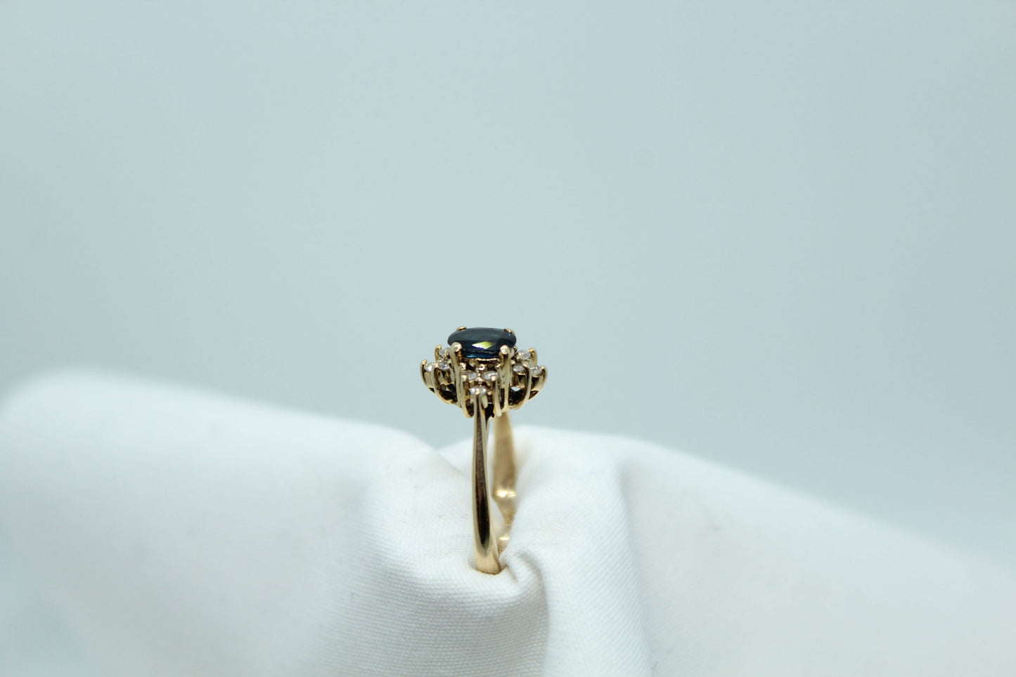 .50CT Blue Oval Sapphire .12CT TW DIA 14K YG Ladies Ring