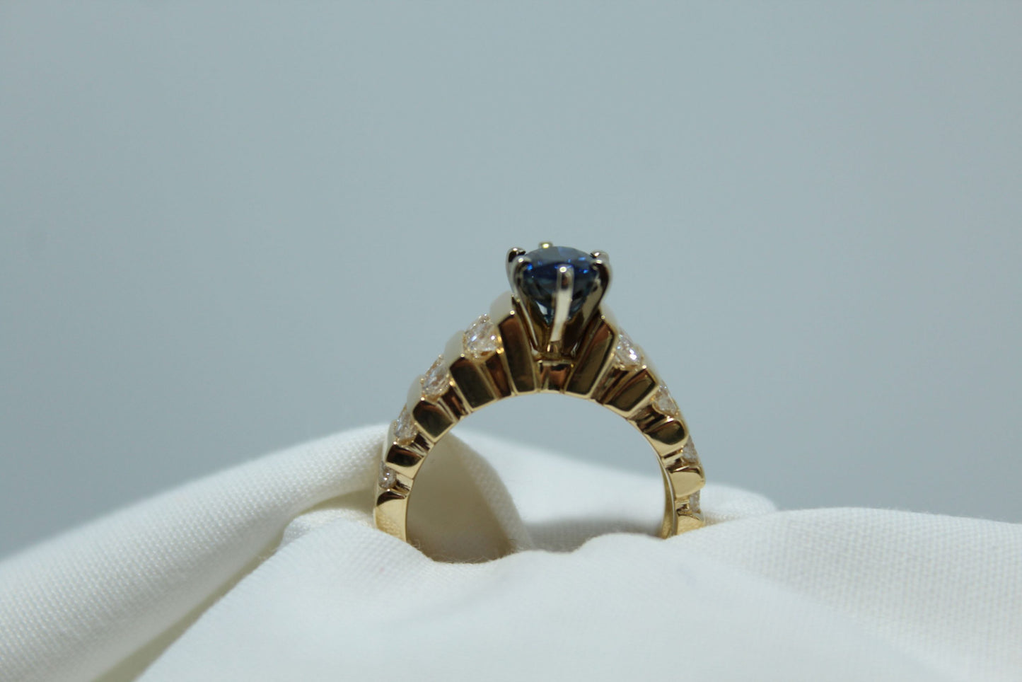 1Ct Oval Madagascar Sapphire .80Ct Diamond TW 18K YG Ladies Ring