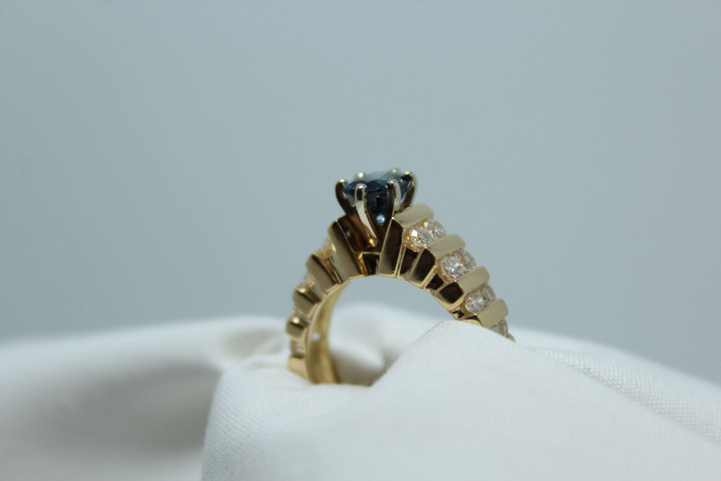 1Ct Oval Madagascar Sapphire .80Ct Diamond TW 18K YG Ladies Ring